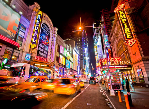 42nd Street New York, USA - June 28th 2014: Times Square and 42nd Street is a busy tourist intersection of neon art and commerce and is an iconic street of New York and America 42nd street photos stock pictures, royalty-free photos & images