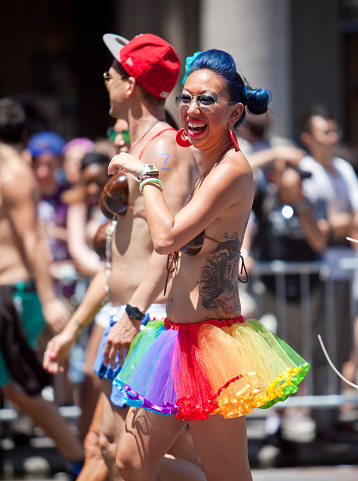 New York, USA - June 29th 2014: Happy Asian woman at the New York City Pride March commemorating the gay rights movement.