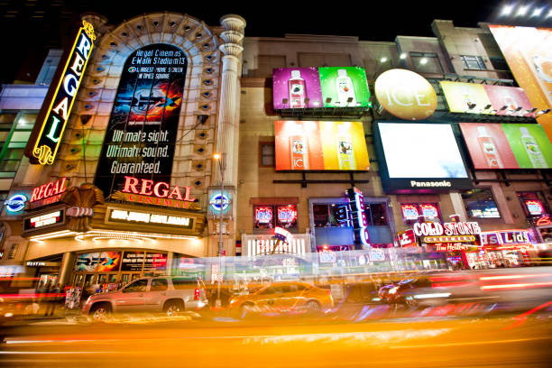 42nd Street New York, USA - June 28th 2014: Times Square and 42nd Street is a busy tourist intersection of neon art and commerce and is an iconic street of New York and America 42nd street stock pictures, royalty-free photos & images