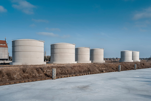 Tanks for liquid products on the quay of the frozen basin of the inland port, Kedzierzyn-Kozle, south-west Poland.