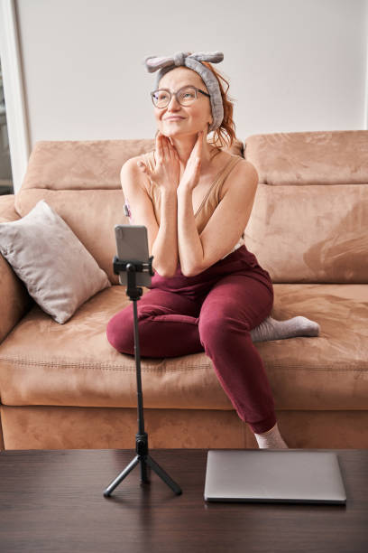istock Young woman posing in front of cellphone 1304062870