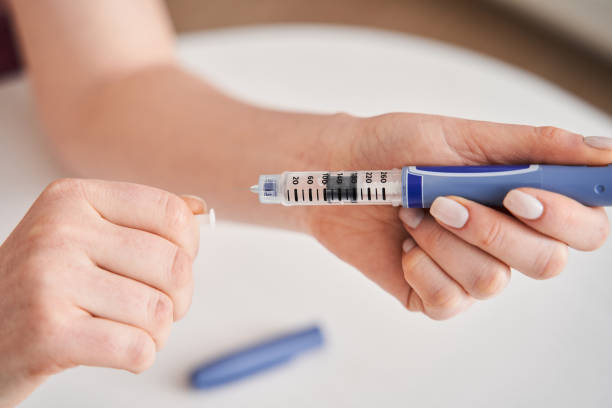 istock Woman patient preparing to making syringe injection 1304062889