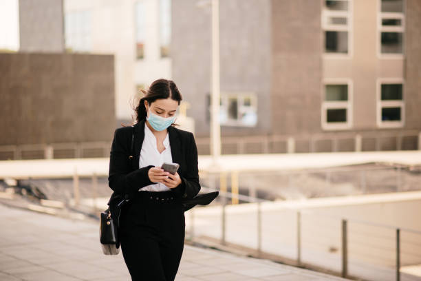 istock Young businesswoman using her smart phone 1304063287