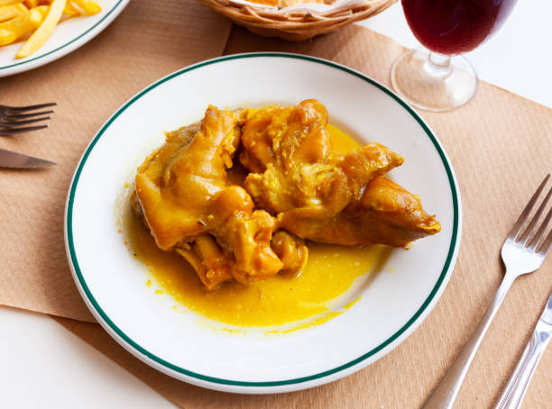 istock Appetizing fried pig legs with potatoes served on plate 1304063359