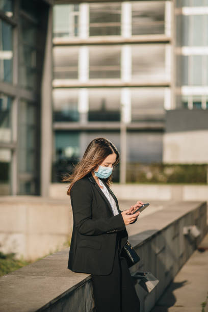 istock Young businesswoman using her smart phone 1304064475