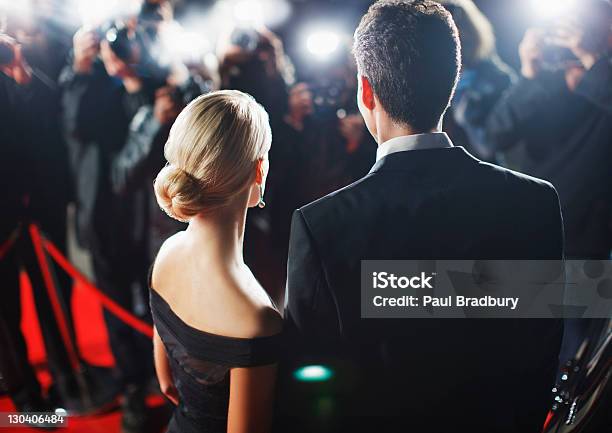 Celebrities Posing For Paparazzi On Red Carpet Stock Photo - Download Image Now - Red Carpet Event, Celebrities, Fame