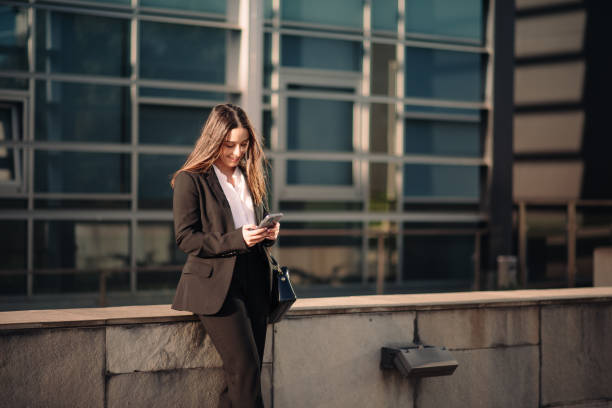 istock Young businesswoman using her smart phone 1304065471
