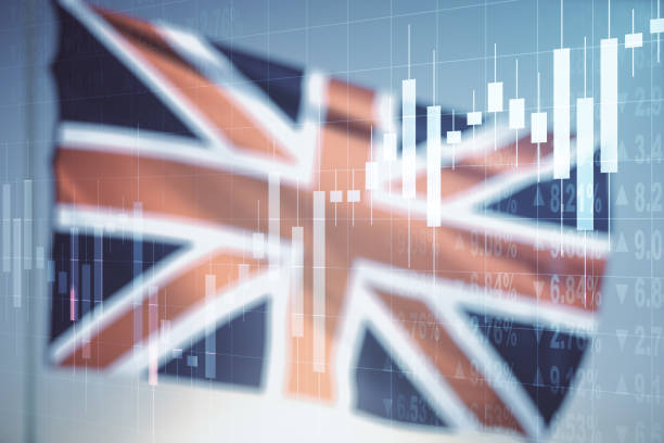 istock Multi exposure of virtual creative financial chart hologram on British flag and blue sky background, research and analytics concept 1304065986