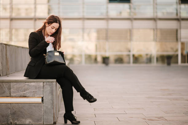 istock Young woman searching inside her purse 1304066327