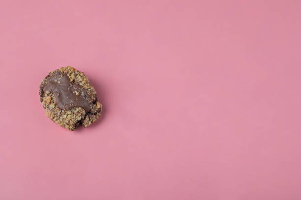 istock Crocante chocolate cookies on a pink background 1304067282