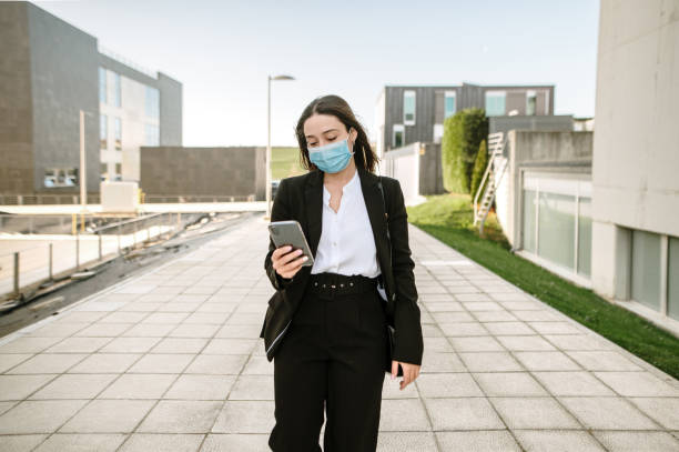istock Young businesswoman using her smart phone 1304068084