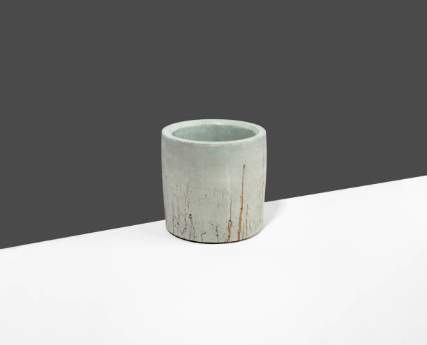 istock Creative diagonal isometric projection. Composition with gray concrete flowerpot. Minimalism. Natural material 1304068305