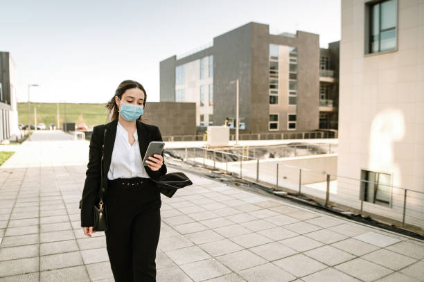 istock Young businesswoman using her smart phone 1304068372