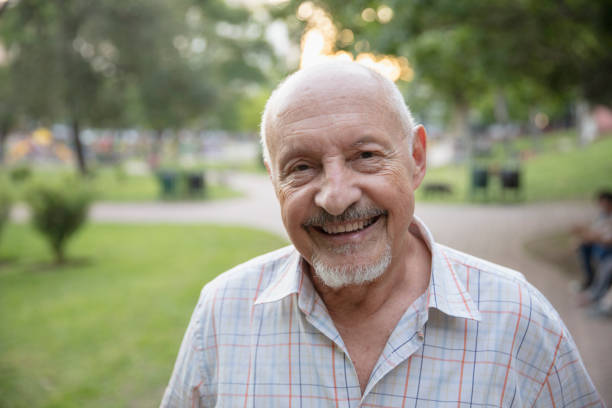 istock Senior man having fun outside in the park 1304069348