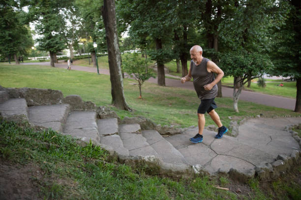 istock Senior man running outside in the park 1304069609