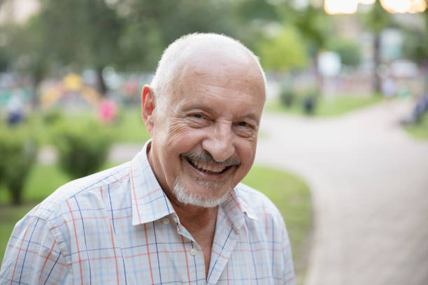 istock Senior man having fun outside in the park 1304069614