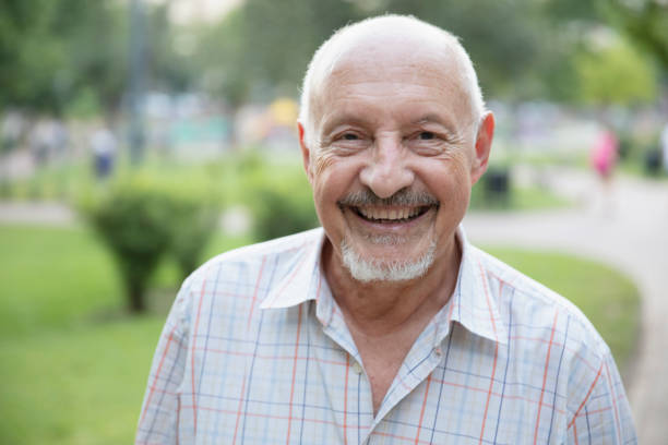 istock Senior man having fun outside in the park 1304069633