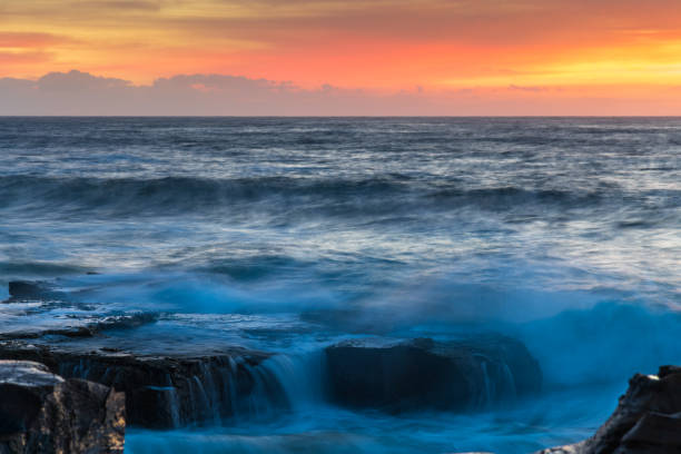 istock High Cloud Sunrise Seascape from Rock Platform 1304071004