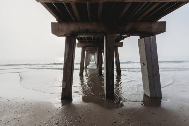 Wide Angle artistic view under the pier in the fog in Naples, FL, United States