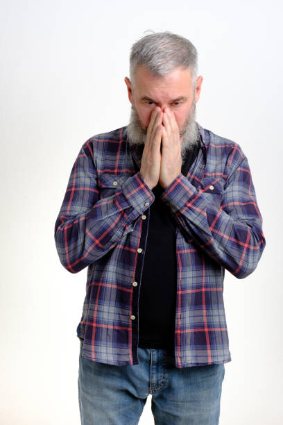 istock Mature bearded man join hands together begging for forgiveness in trouble, asking for help, isolated on white backdrop 1304072972