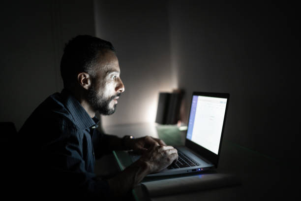 istock Man working at night at home 1304073890