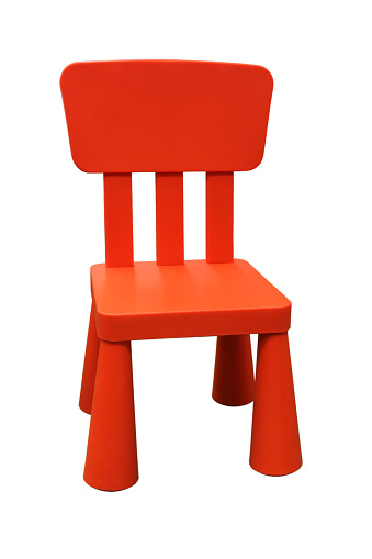 Red plastic children chair isolated on white background
