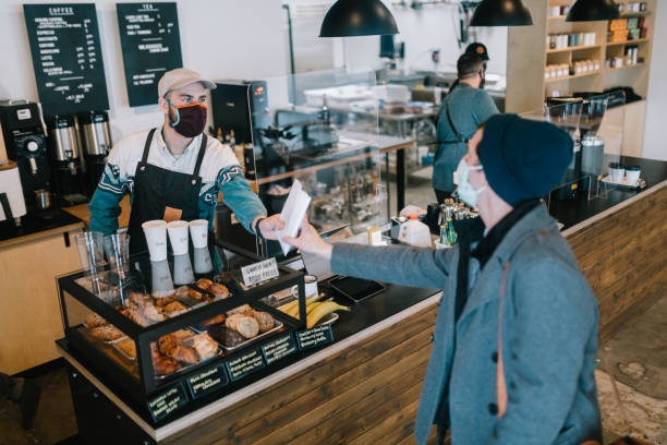 istock Coffee Shop Small Business Owner At Work During Pandemic 1304076285