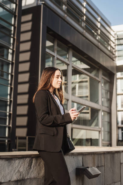 istock Young business woman using a smartphone 1304077840