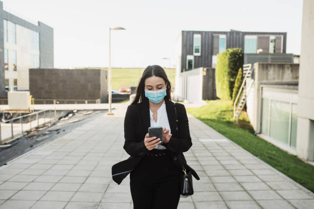 istock Young business woman using a smartphone 1304077988