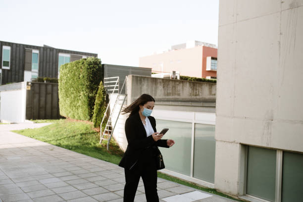 istock Young business woman using a smartphone 1304078013