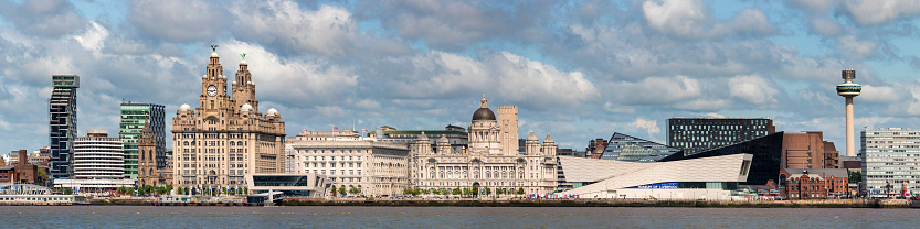 Liverpool, England, UK - 24th May 2015: The three graces of Liverpool along with the Museum of Liverpool on the banks of the River Mersey, Liverpool, England, UK.