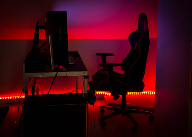 istock Modern LED red ambient light around gaming computer set at home. Home decor concept. 1304081694