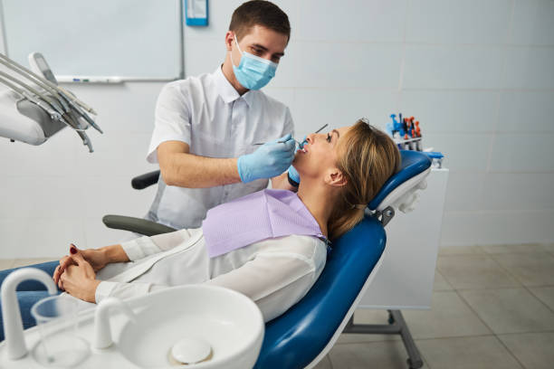 istock Examination of female teeth by a dentist 1304083313