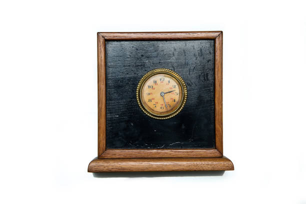 istock The antique wooden clock isolated on a white background. 1304083723