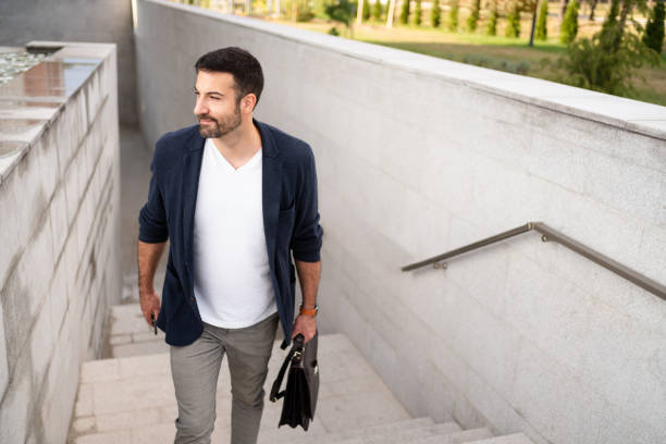 istock Young businessman moving upstairs on his way to work 1304083849