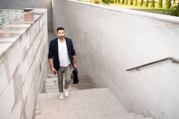istock Modern young  businessman moving upstairs 1304083853