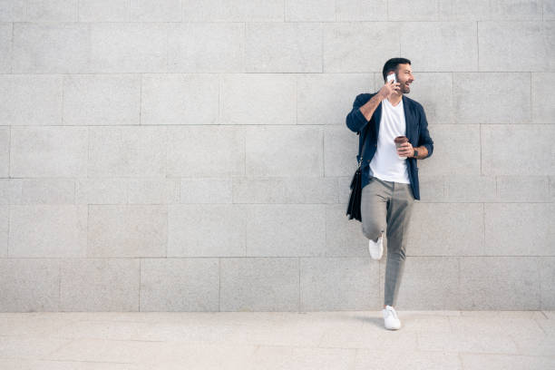 istock Young man on the phone looking away 1304083918