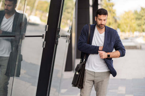 istock Young businessman going to work and checking his pocket 1304083947