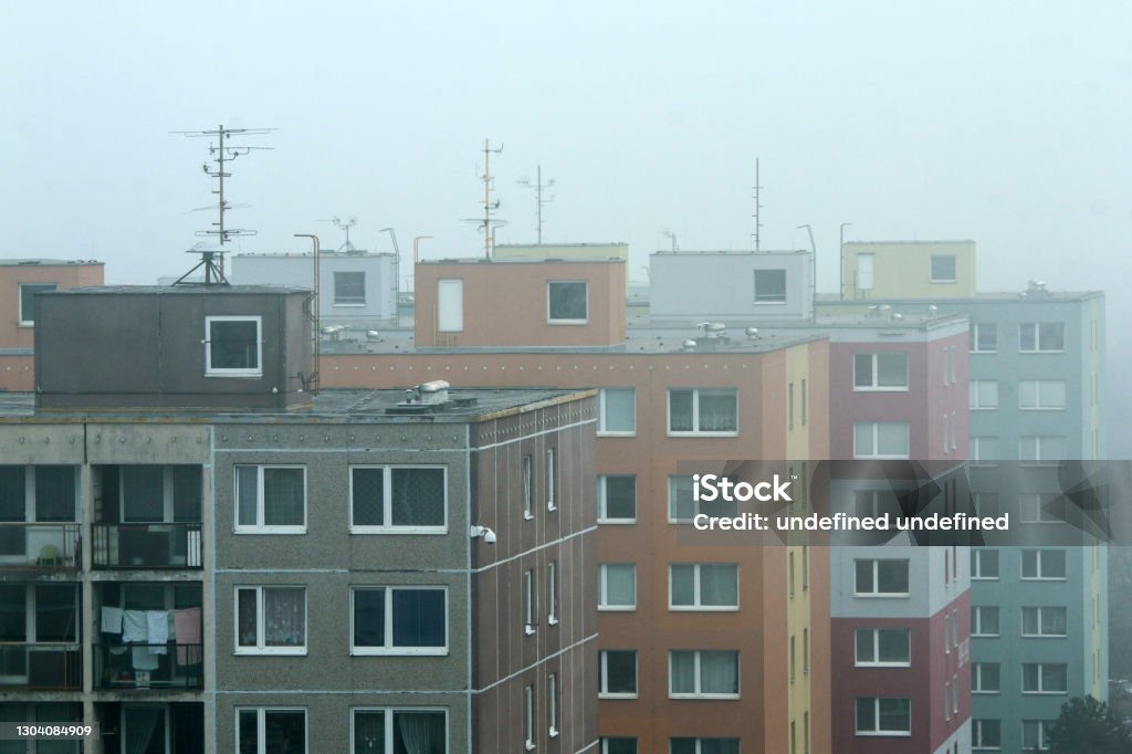 detail of the part of the big area of high rise block of flats The misty morning detail of the part of the big area of high rise block of flats from the socialist era in Prague in Czech Republic called Černý most. Like rabbit hutches fot the people. House Stock Photo