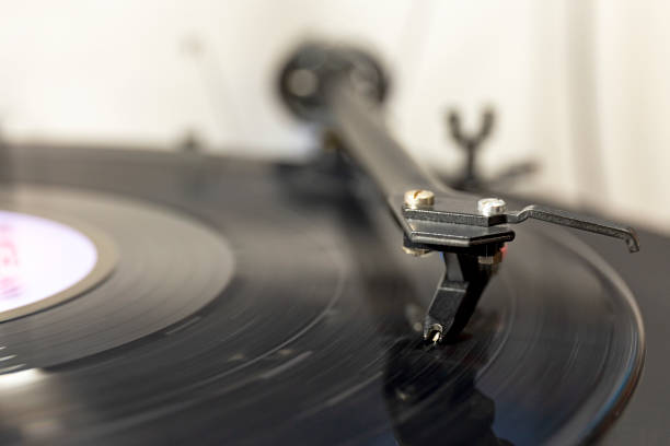 istock Close-up of a turntable and a playing vinyl record. 1304086126