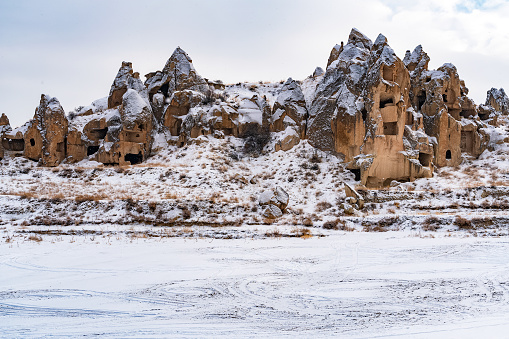 Fairy Chimney in Cappadocia in winter, under snowfall