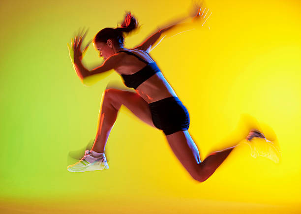 Blurred view of athlete running  long jump stock pictures, royalty-free photos & images