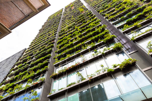 istock Low angle view of appartment building with vertical garden, background with copy space 1304091143