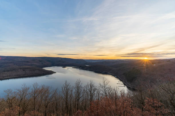 istock Beautiful sunset over lake and forest 1304091586