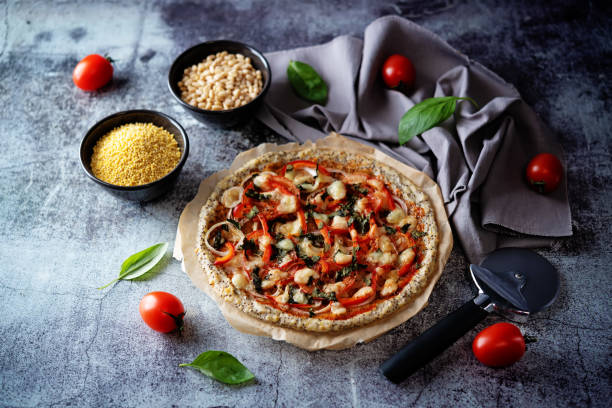 Millet pine nuts Chia seeds pizza crust with tomato; red bell pepper, onion and basil