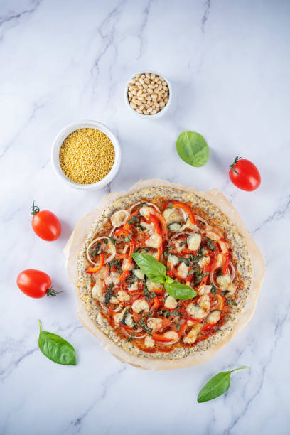 Millet pine nuts Chia seeds pizza crust with tomato; red bell pepper, onion and basil