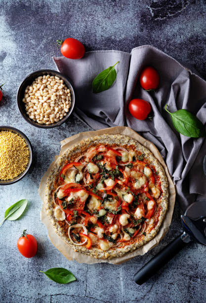Millet pine nuts Chia seeds pizza crust with tomato; red bell pepper, onion and basil