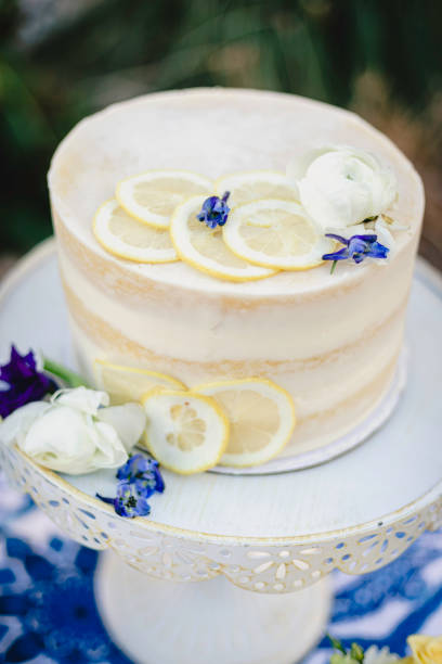 istock Small wedding cake with blue and yellow lemon accents 1304094523