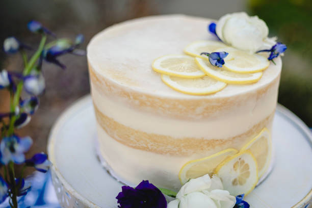 istock Small wedding cake with blue and yellow lemon accents 1304094542