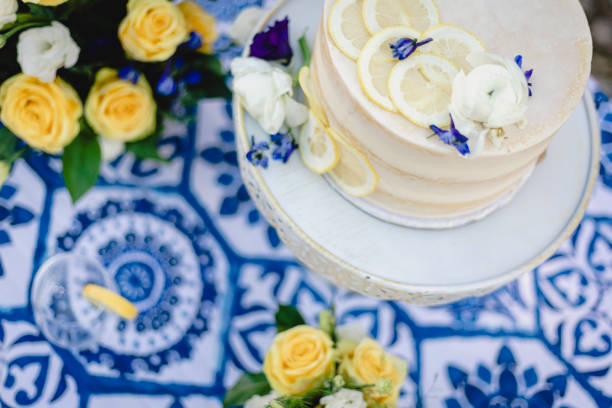 istock Small wedding cake with blue and yellow lemon accents 1304094546